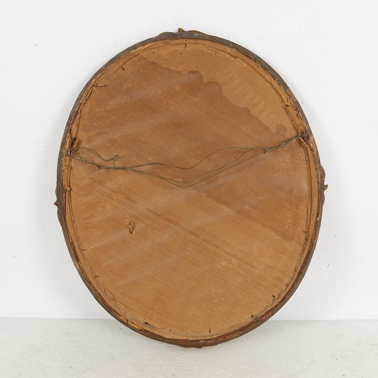 An oval mirror, around 1900.