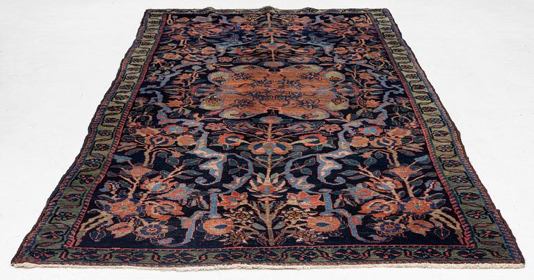 An antique Hamadan, c. 315 x 155 cm.