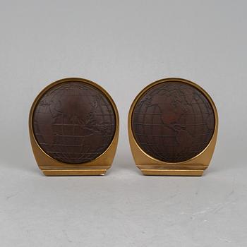 A pair of brass book ends, mid 20th century.