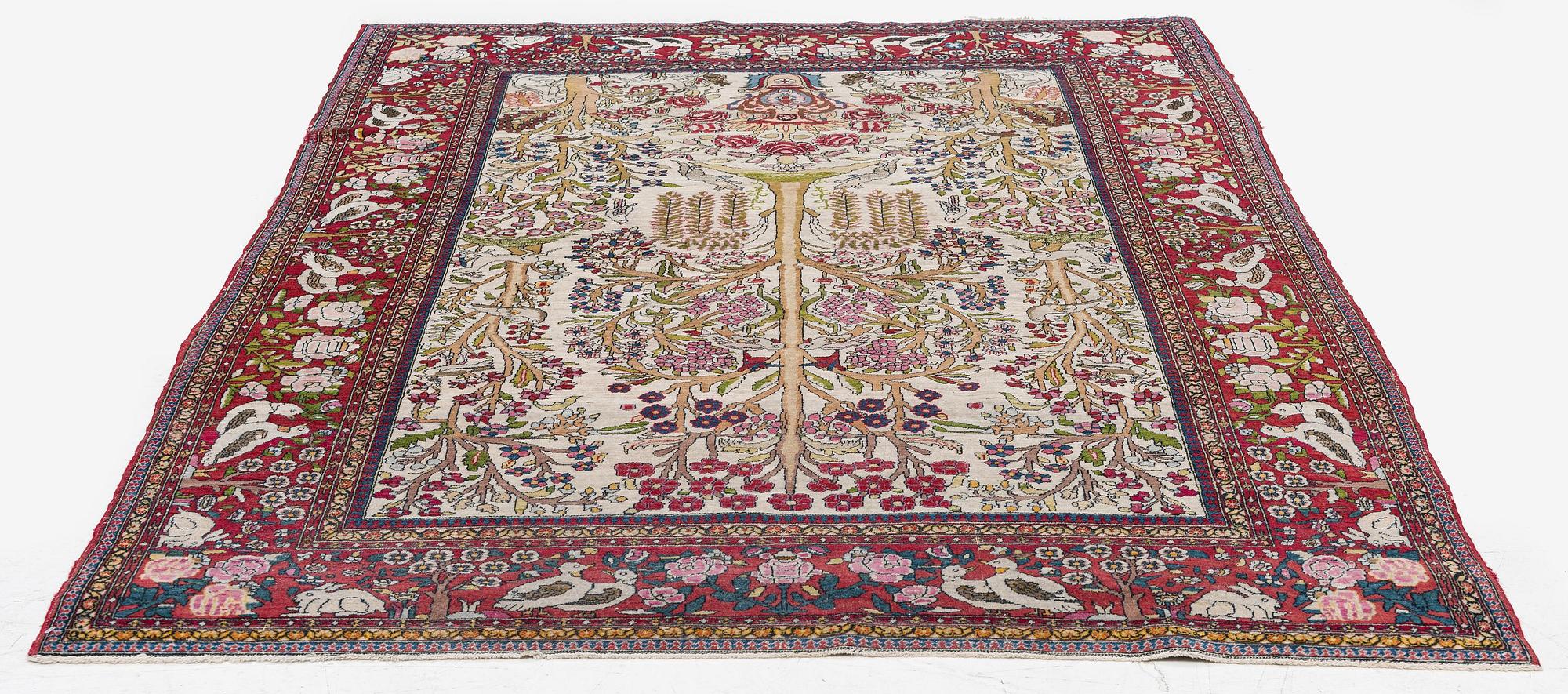 An antique pictoral Esfahan rug, Central Persia (Iran), c 213 x 142 cm.