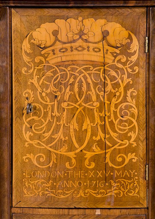 An English early 18th century walnut veneered and gilt bronze Bureau-Cabinet decorated with marquetry in première and contre partie on both sides of a cabinet door "LONDON THE XXV MAY ANNO 1716" under monogram SGB and Marquess's coronet.