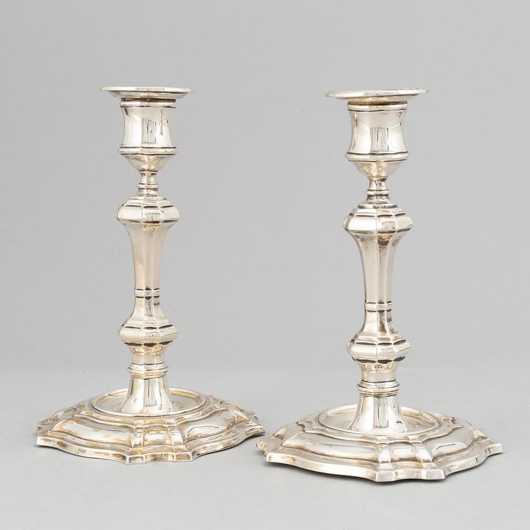A pair of silver candlesticks, mark of William Hutton & Sons Ltd, London 1900.