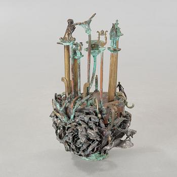 a metal sculpture, signed and dated 1980.