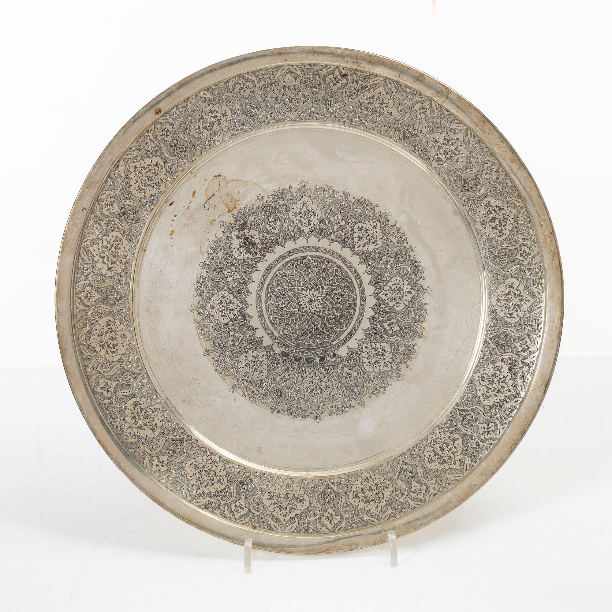A pair of Persian silver plates, 20th century.