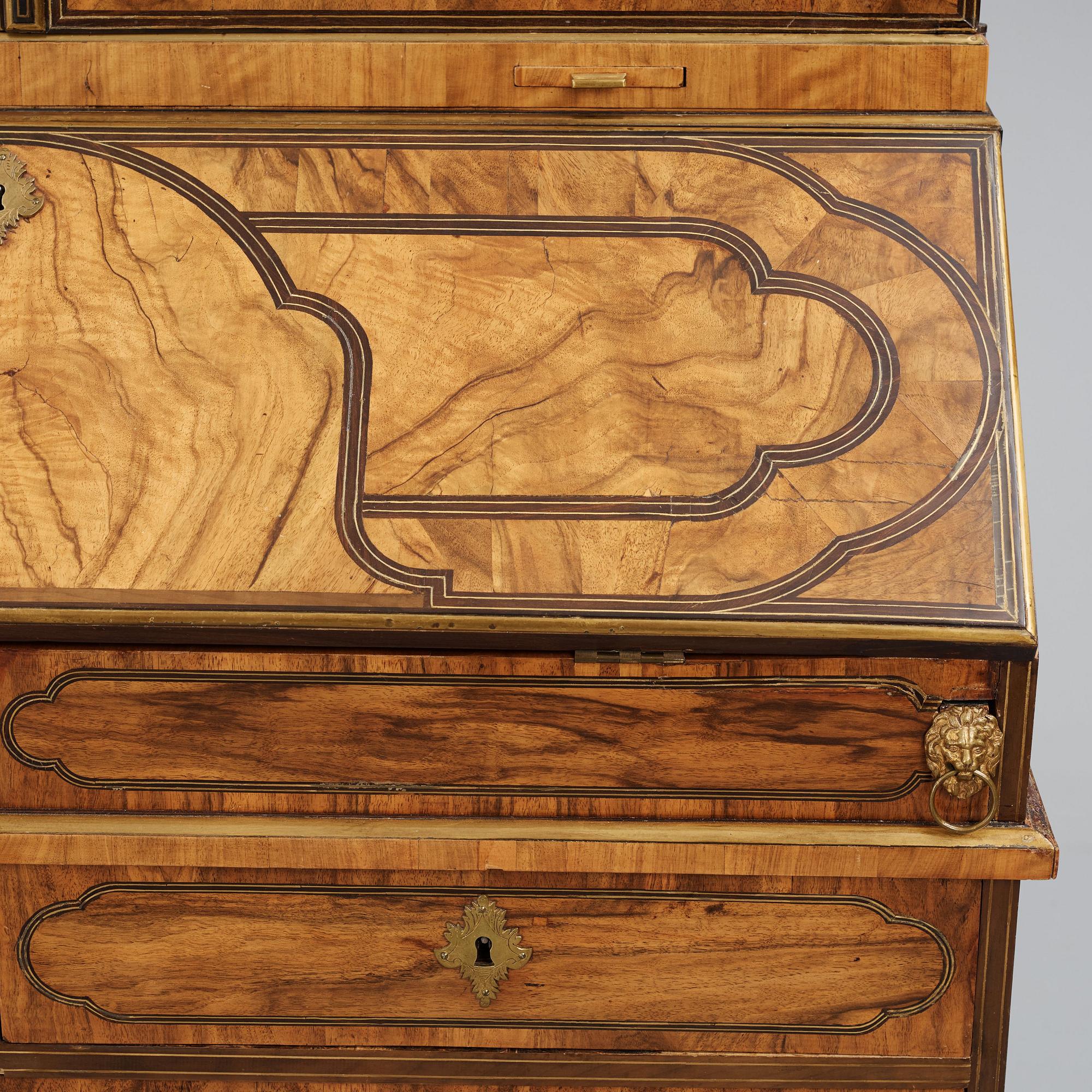 A late Baroque walnut veneer cabinet, mid 18th century.