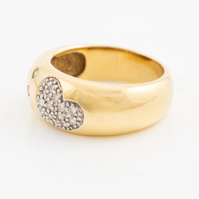 Ring in 18K gold set with round brilliant-cut diamonds.