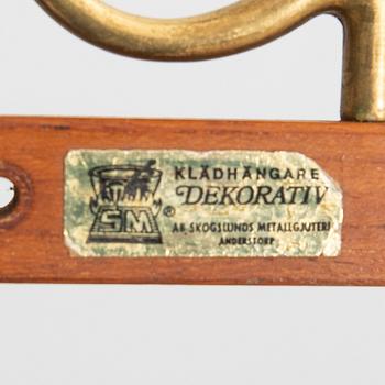 Klädhängare, "Dekorativ", Skoglunds metallgjuteri, Anderstorp, 1900-talets mitt.