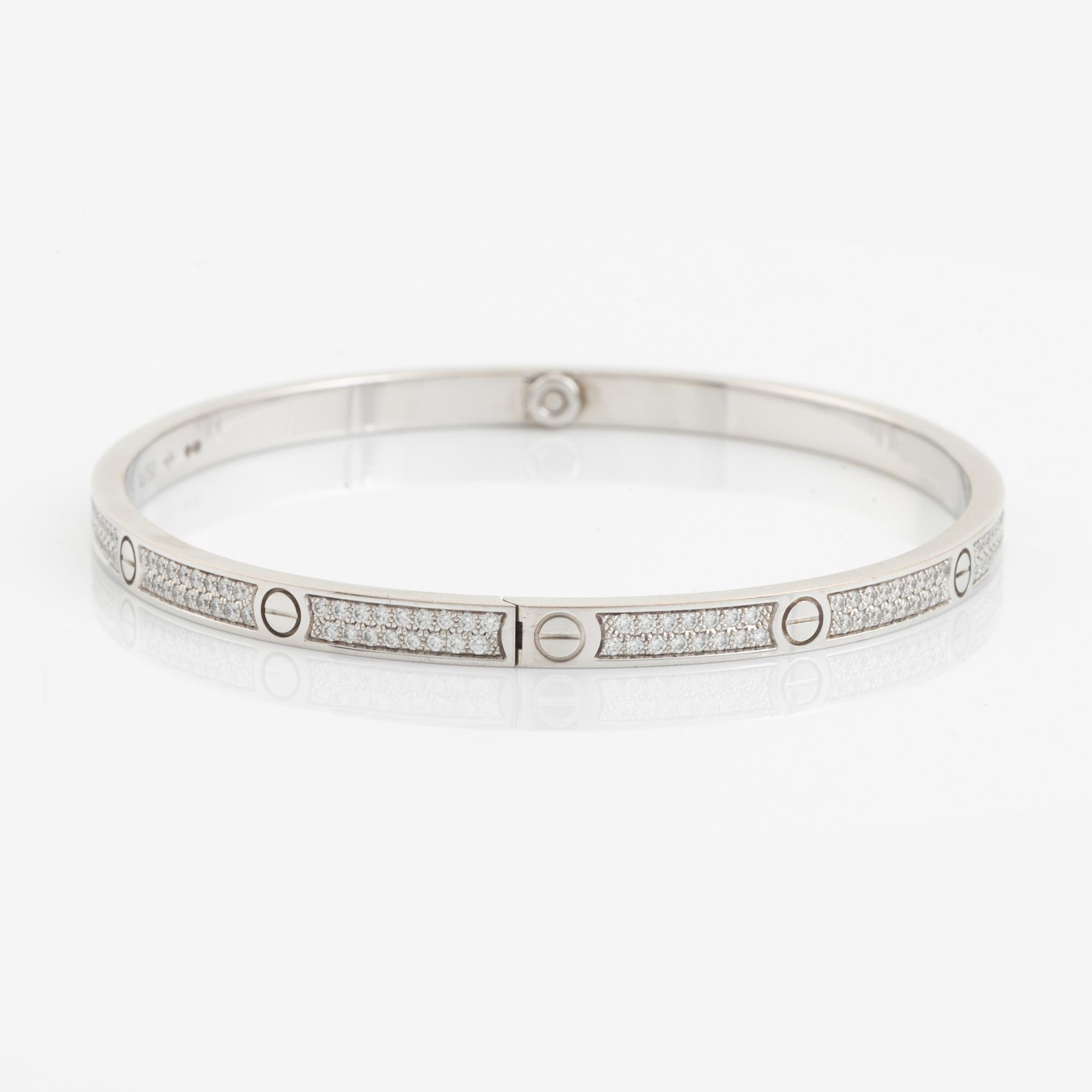 A Cartier "Love" bracelet small model in 18K white gold with round brilliant-cut diamonds.