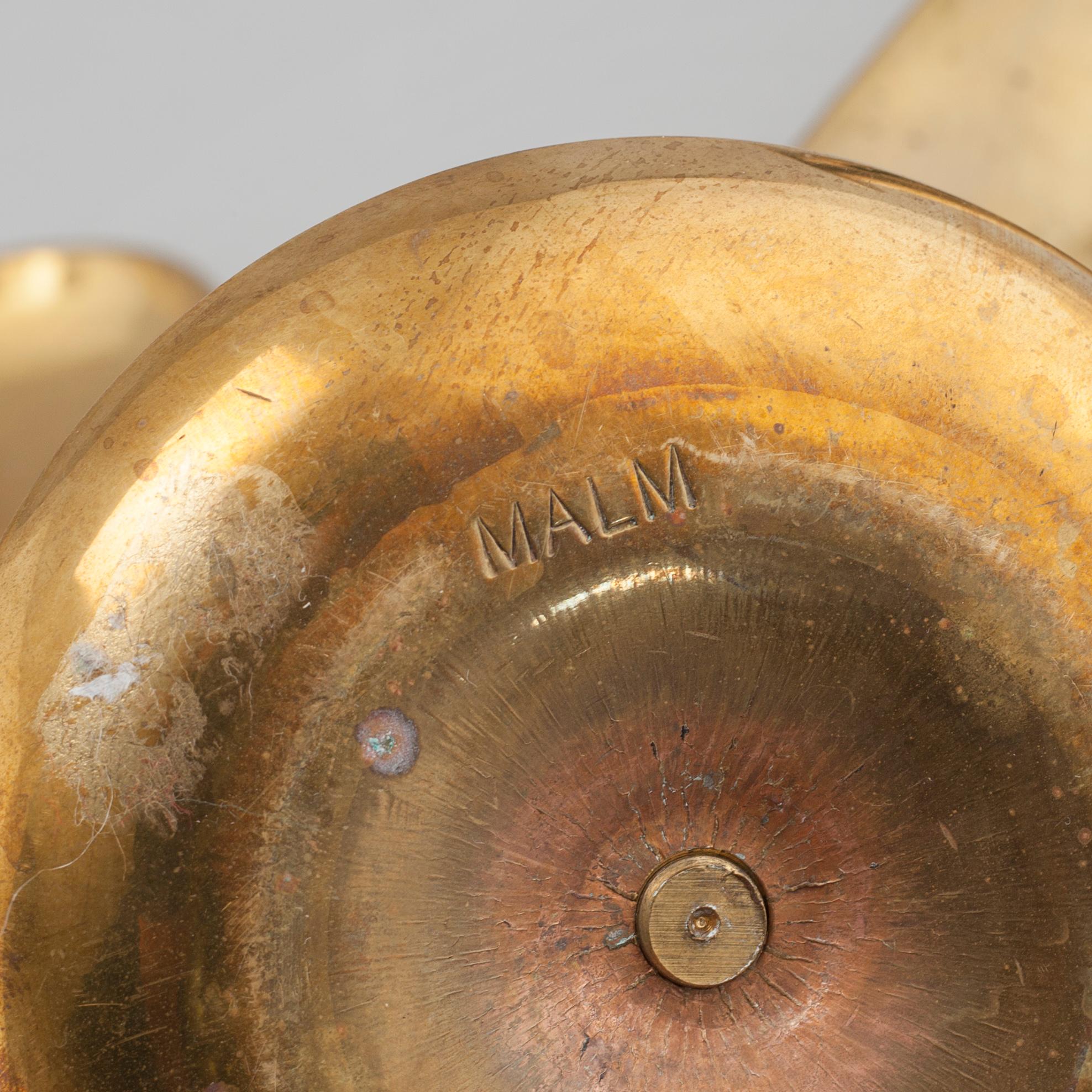 Nine brass candlesticks, 20th century.