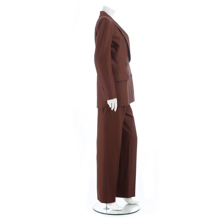 YVES SAINT LAURENT, a brown two-pieces wool suit consisting of jacket and pants. Size 40.