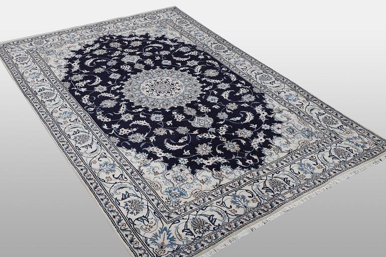 A carpet, Nain, part silk, ca 310 x 205 cm.