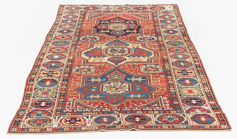 An antique Konya long rug, c. 324 x 144 cm.