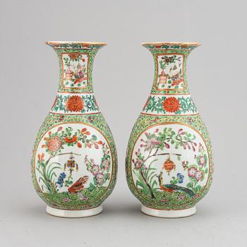 A pair of famille rose canton vases, early 20th century.