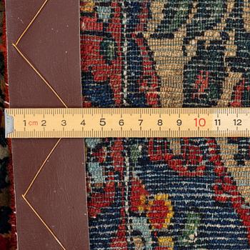 A figural oriental rug, c.. 230 x 130 cm.