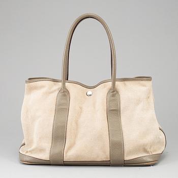 HERMÈS, a canvas and leather 'Garden Party' bag.