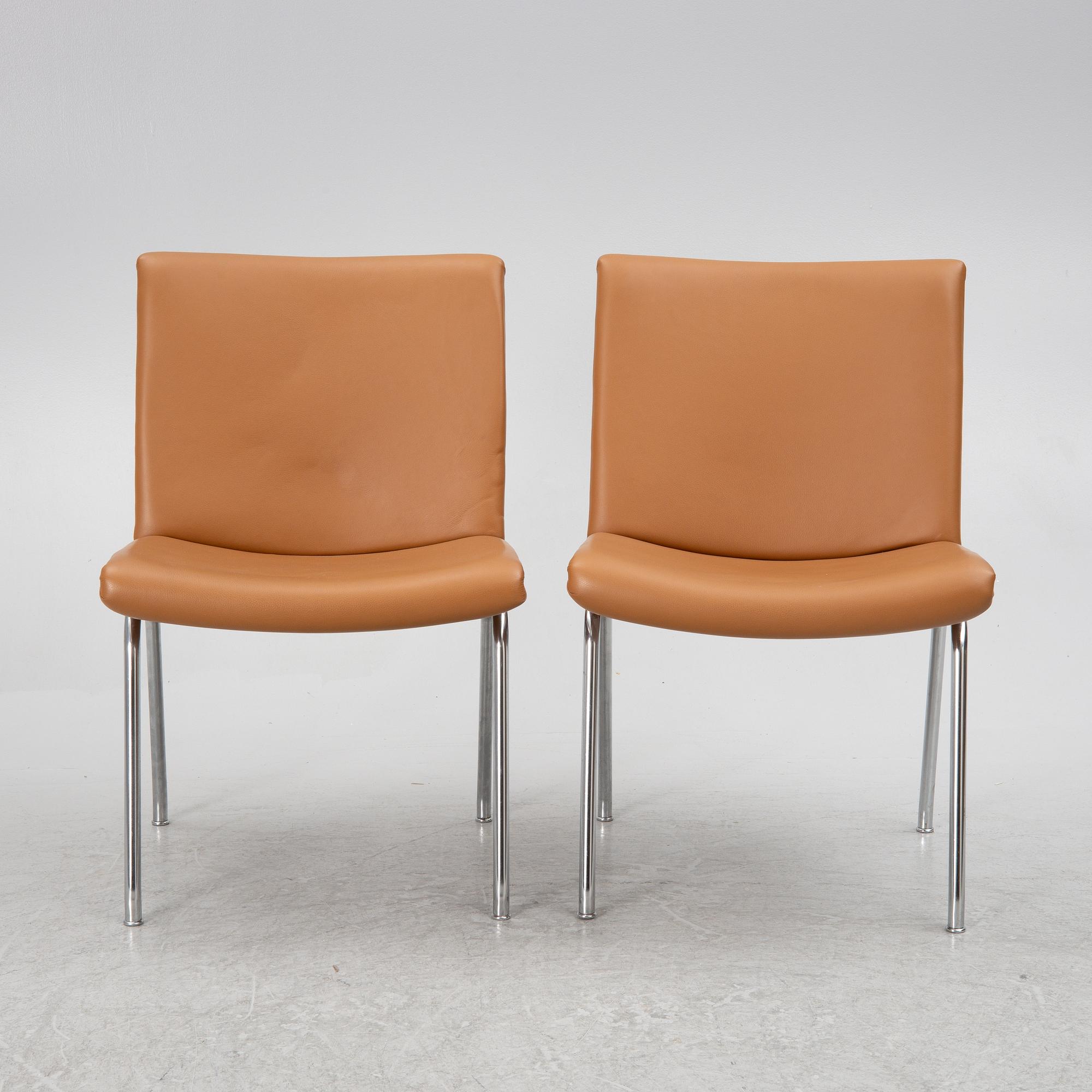 Hans J. Wegner, a pair pf "Kastrup Airport" lounge chairs, Denmark, late 20th century.
