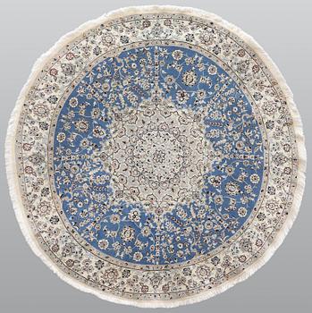 A round part silk Nain rug, so called 9 LAA, diameter 195 cm.