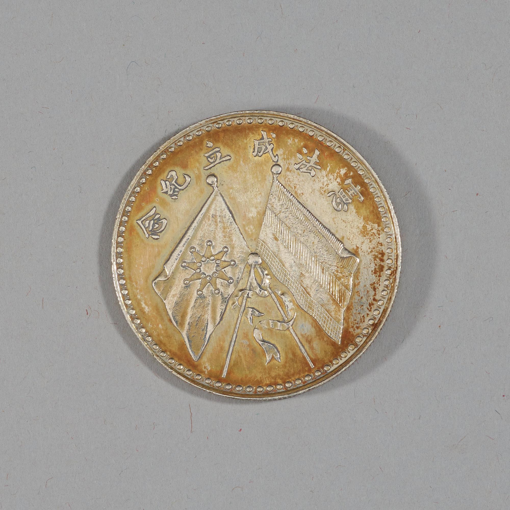 A box with five silver coins, Republic, early 20th Century.