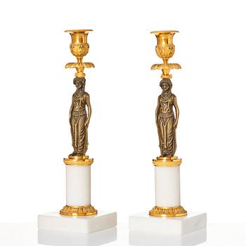 A pair of late Gustavian ormolu, patinated bronze, and marble candlessticks attributed to F. L. Rung (1758-1837).