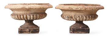 1704. A pair of English 19th century stoneware garden urns.