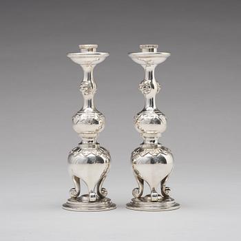 A pair of Chinese silver candle sticks, Shanghai, early 20th Century.