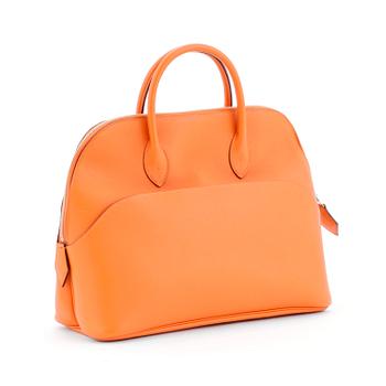 675. HERMÈS, a orange calf leather handbag, "Bolide".