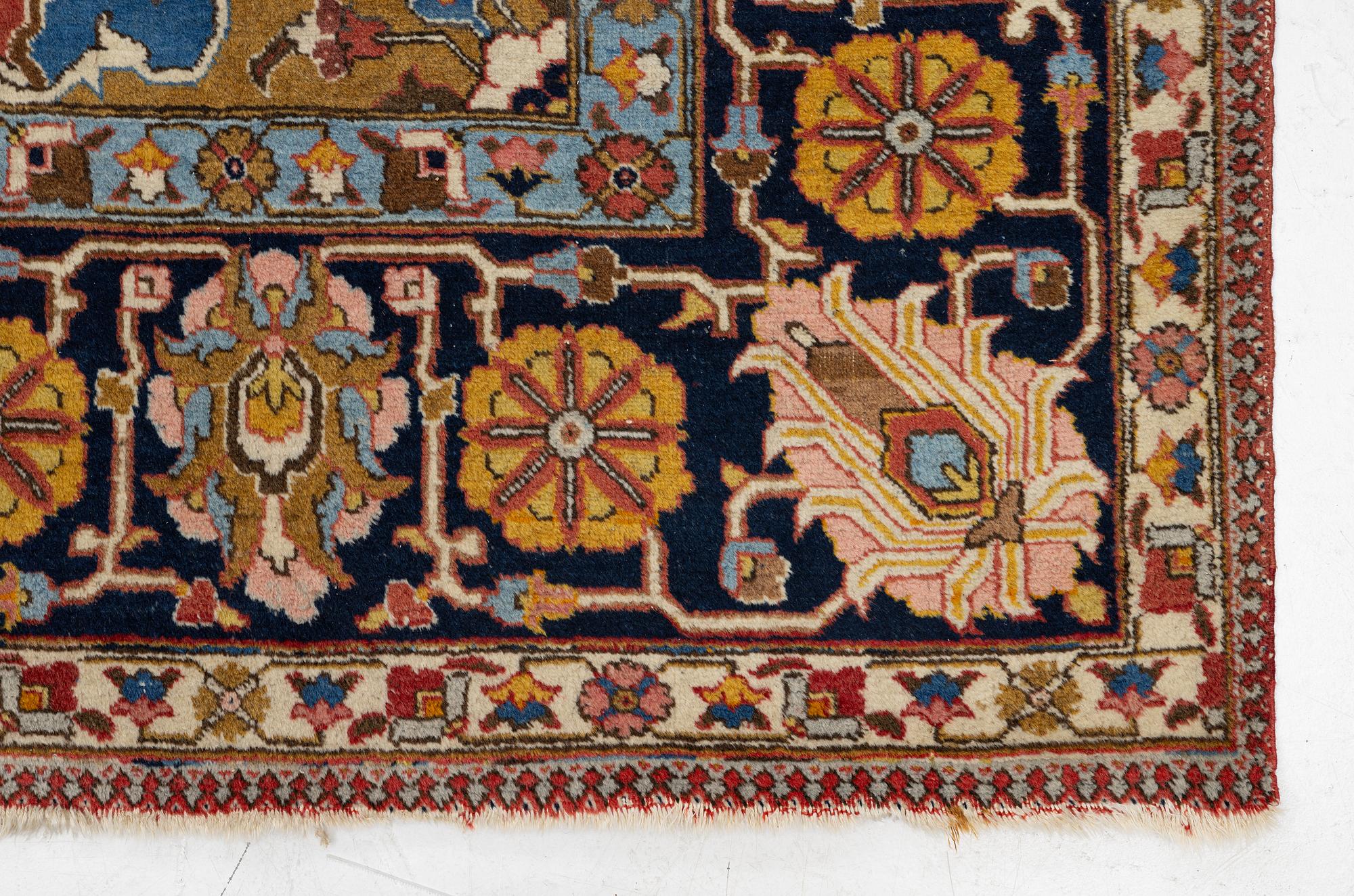 An antique Tabriz carpet, c. 365 x 280 cm.