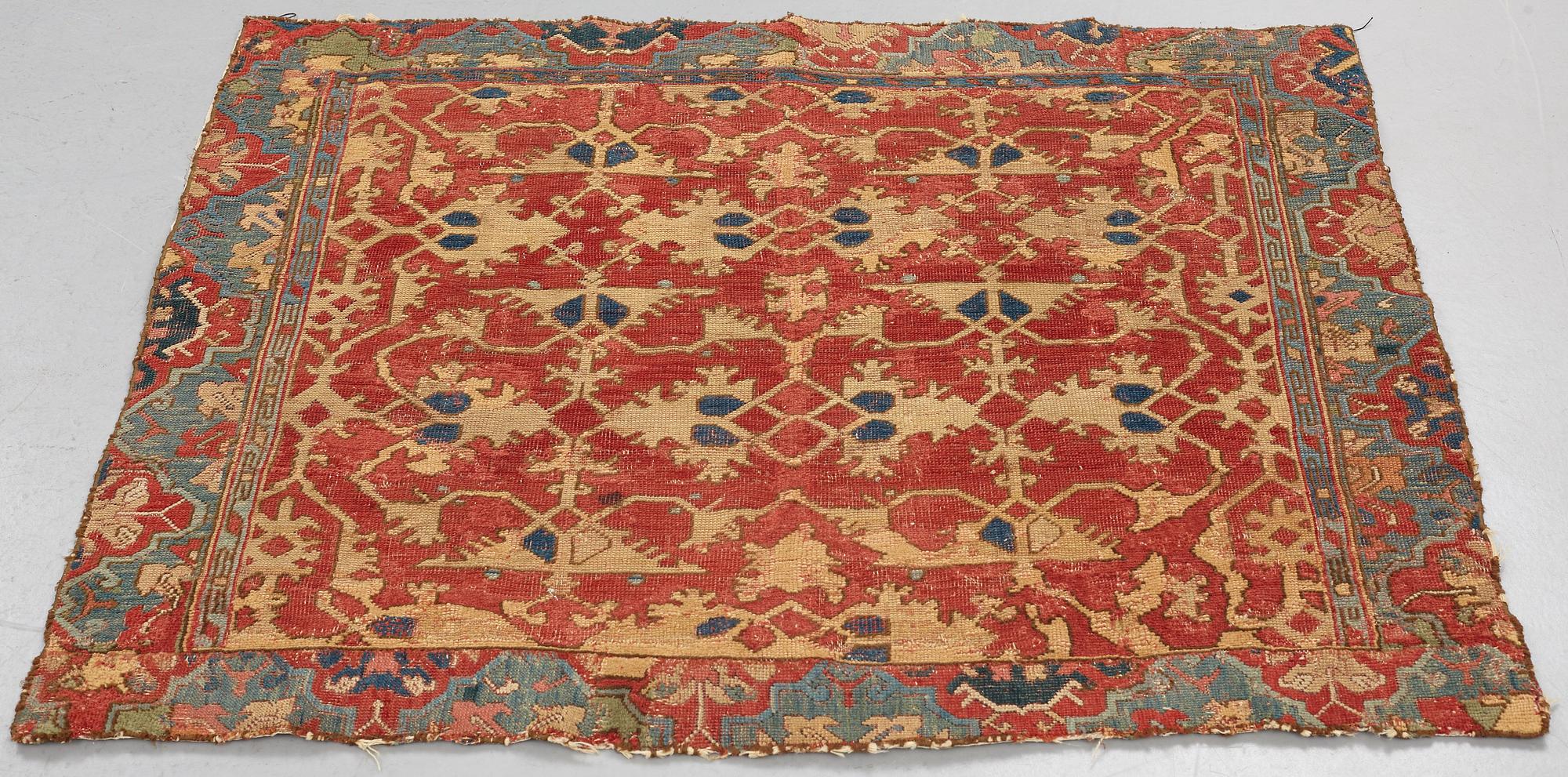 A CARPET FRAGMENT, an antique Western Anatolian "Lotto", 17th century, ca 105 x 125 cm.