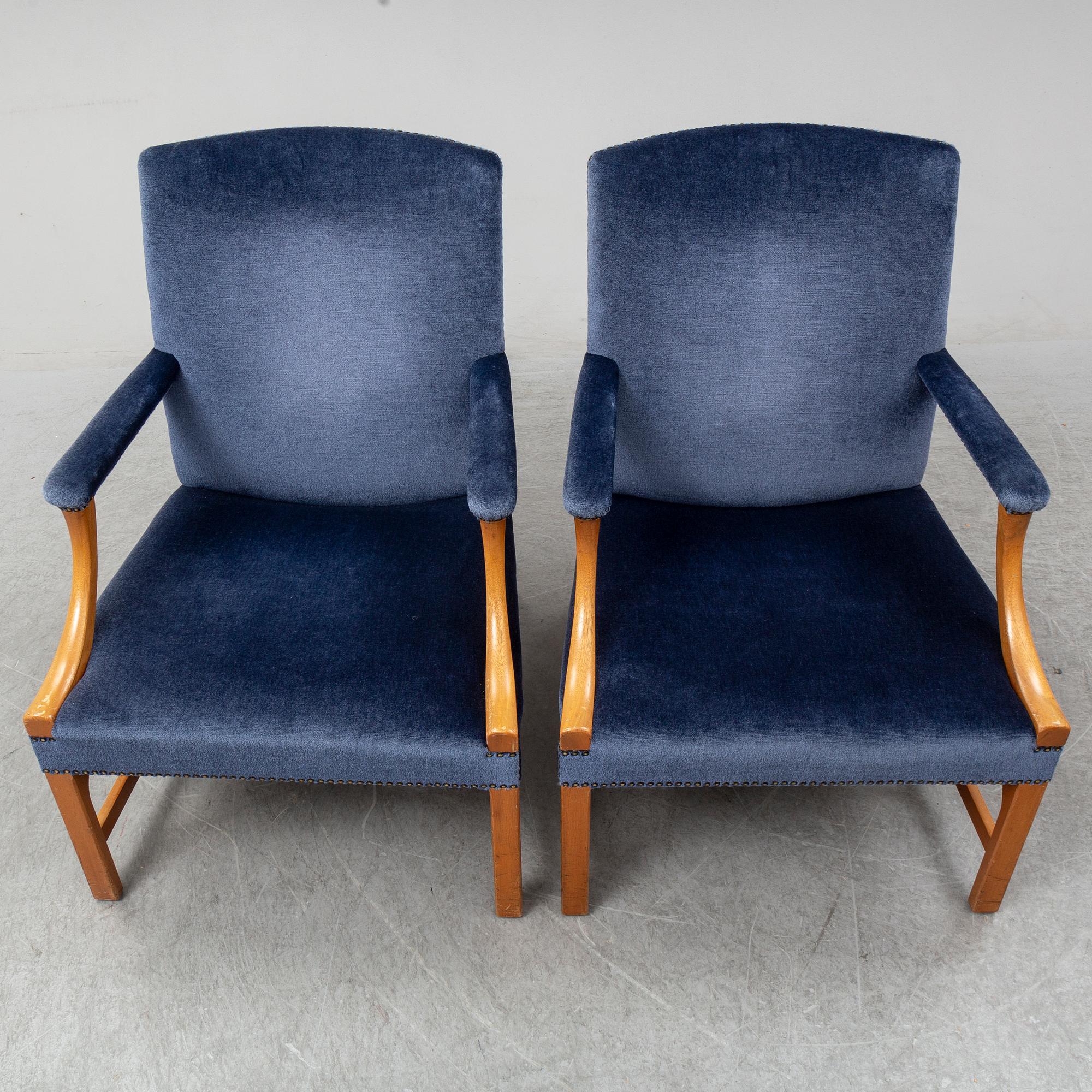 A mid 20th Century pair of oak armchairs attributed to Carl Malmsten.