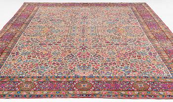 An antique 'Millefleur' Kerman Laver carpet, ca 434 x 321 cm.