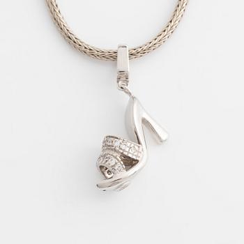 18K white gold shoe pendant with faceted white stones, silver chain.