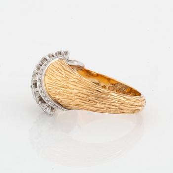 A WA Bolin ring in 18K gold set with round brilliant-cut diamonds.