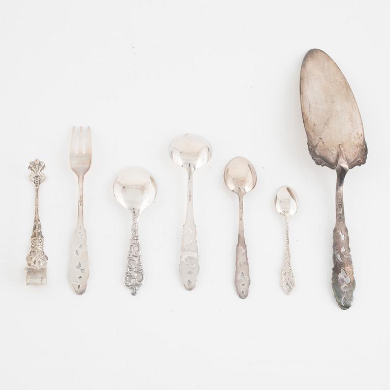 A 37-piece set of dessert cutlery, mostly the same model, with Swedish import marks.