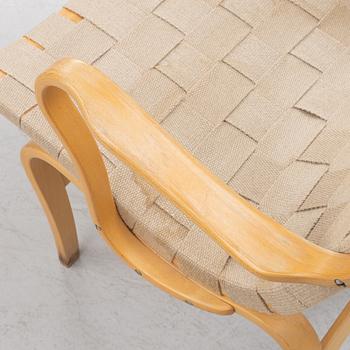 Bruno Mathsson, a pir of 'Eva' armchairs, Dux, late 20th century.