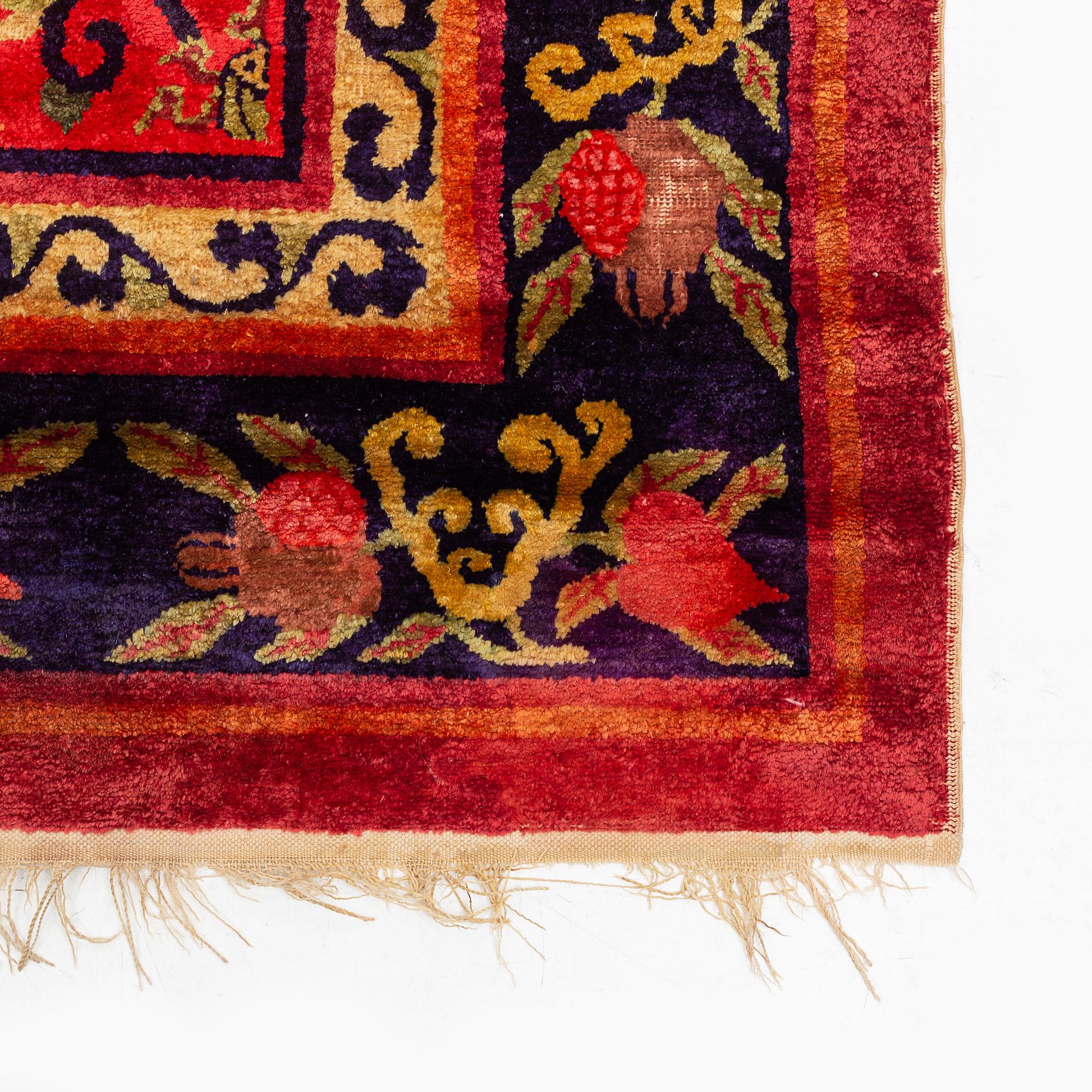 An East Turkestan silk carpet, ca 308 x 182 cm.