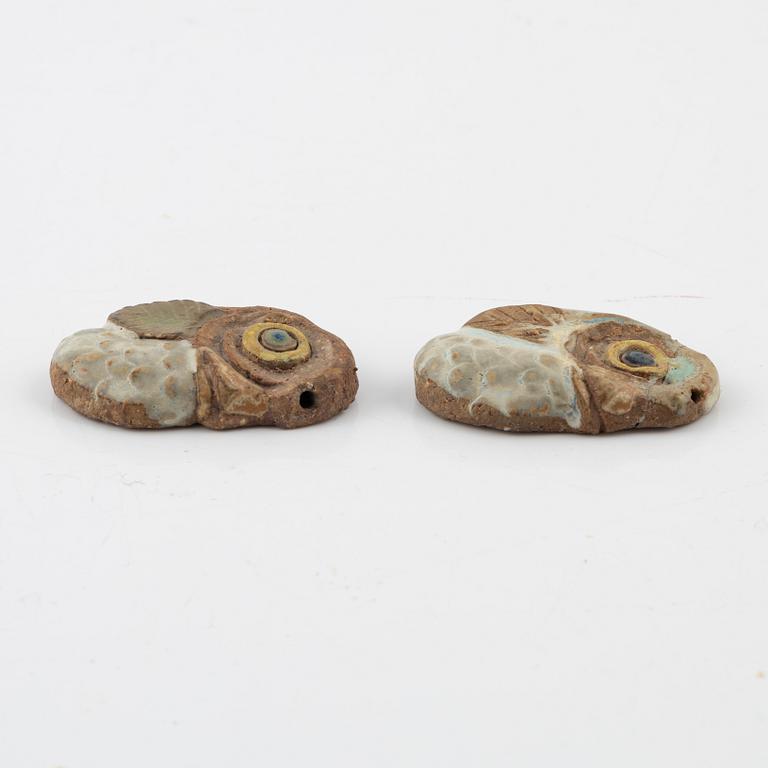 Tyra Lundgren, two stoneware pendants.