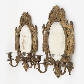 A pair of eclectic mirror sconces, first half of the 20th century.