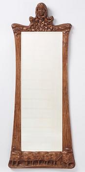 Edvard Nilsson, an Art Nouveau sculptured mirror with table, Sweden , early 20thC.