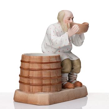 A Russian Gardner bisquit porcelain figure of a peasant, Moscow, 19th Century.