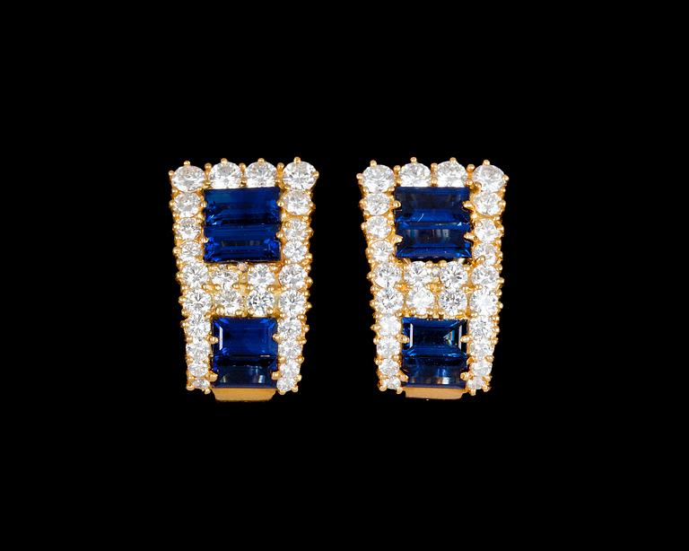 A pair of blue sapphire and diamond earrings.