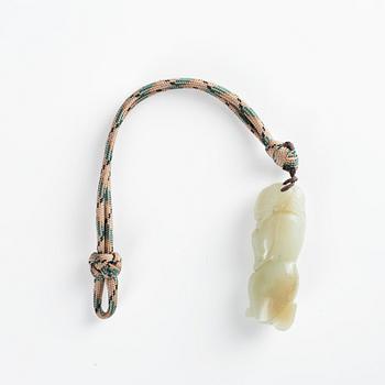 A nephrite pendant and sculpture, 20th Century.