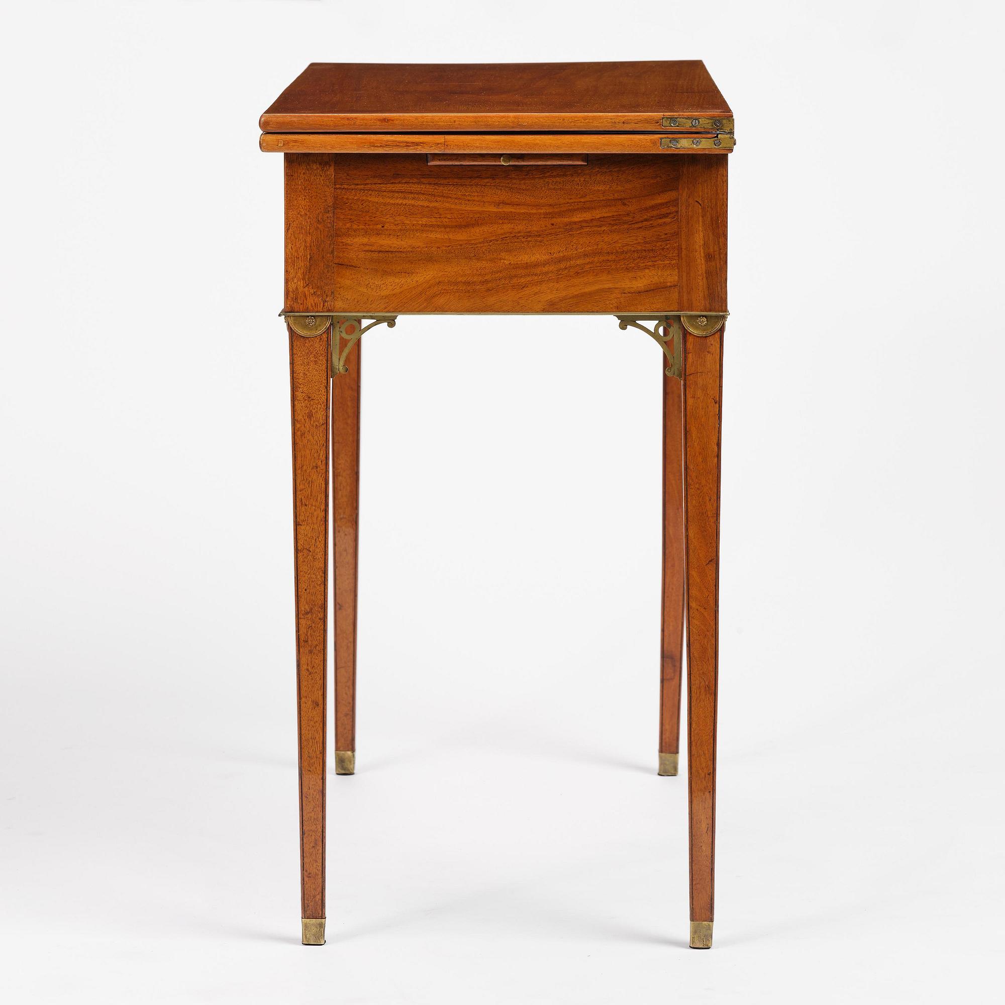 A late Gustavian mahogany games table, presumably by A. Nordström (Journeyman at G. Iwersson 1806-09).