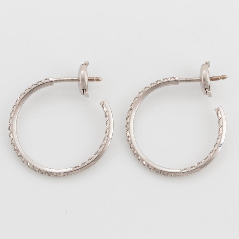 A pair of Tiffany "Metro" 18K white gold hoops set with round brilliant-cut diamonds.