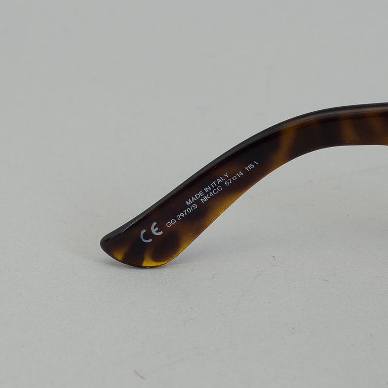 A pair of Gucci GG2970/S sunglasses with case.