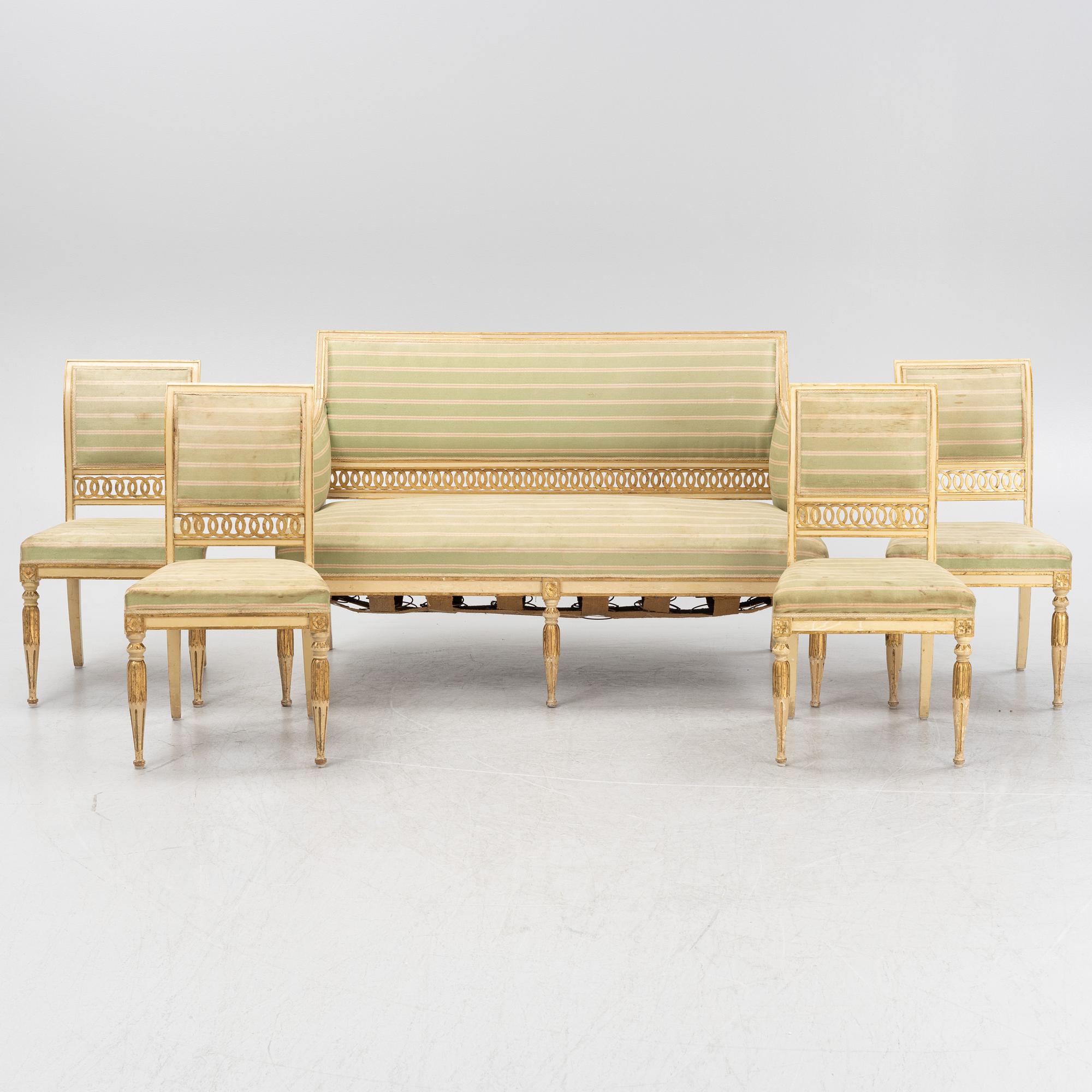 A late Gustaivan style sofa and four matched chairs from around the year 1900.