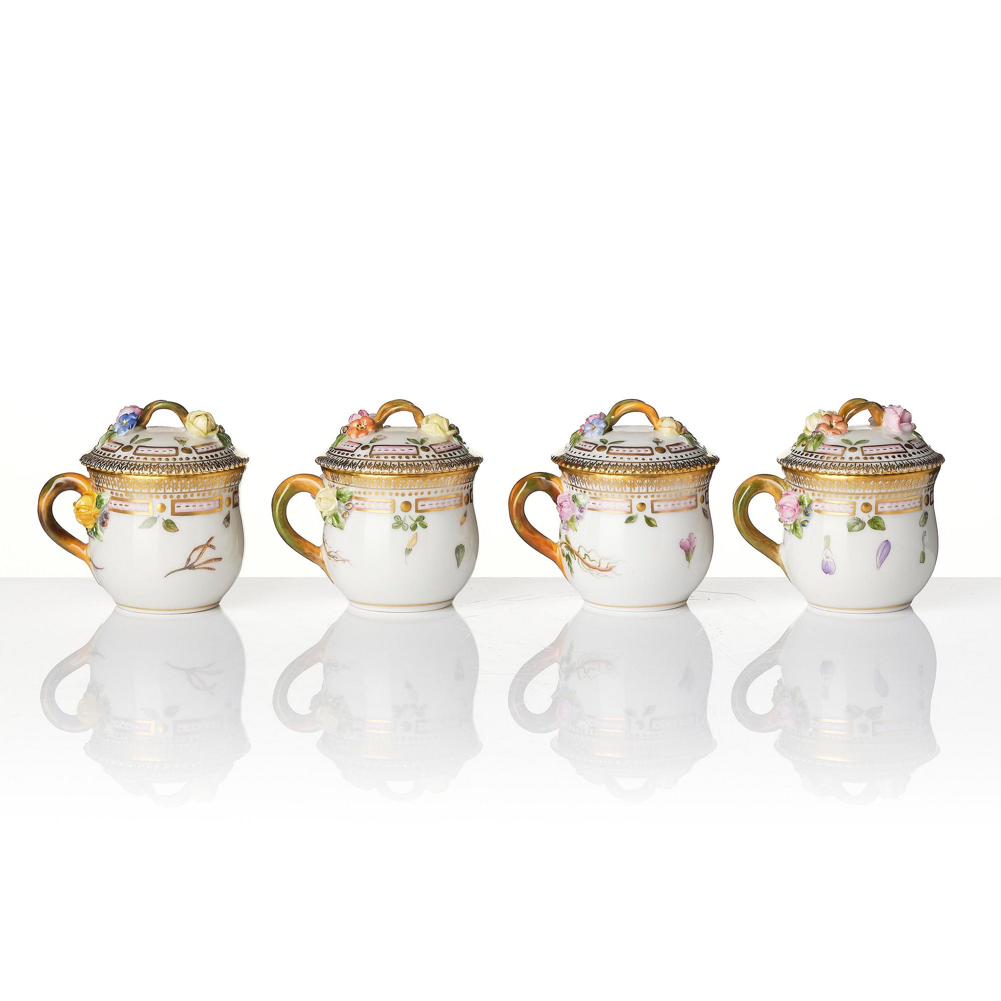 A set with four Royal Copenhagen 'Flora Danica' custard cups with covers and stands, Denmark, 20th century.