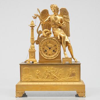 An Empire mantel clock, first half of the 19th century.