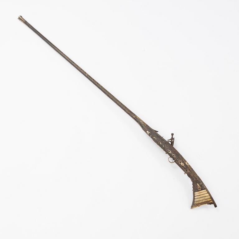 A snaphaunce gun, 19th Century.