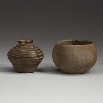 Two potted jars and a bronze belt hook, Han Dynasty (206 BC.-220 AD).