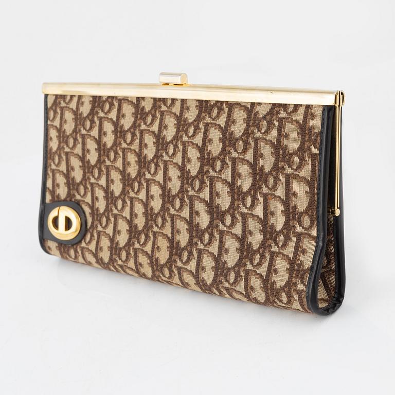 Christian Dior, a canvas clutch.